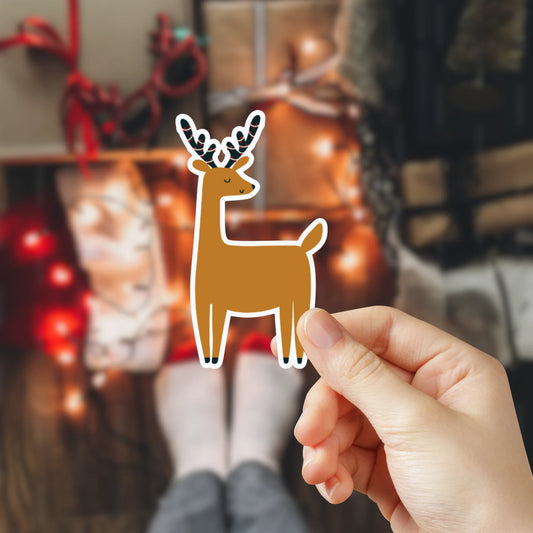 Pegatinas de vinilo de Navidad laminadas, resistentes al agua, perfectas para personalizar móviles, portátiles o botellas. Diseño navideño de 5x5 cm de un reno.